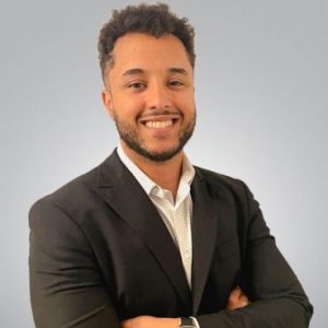 William Ferraz de Santana smiles at the camera.