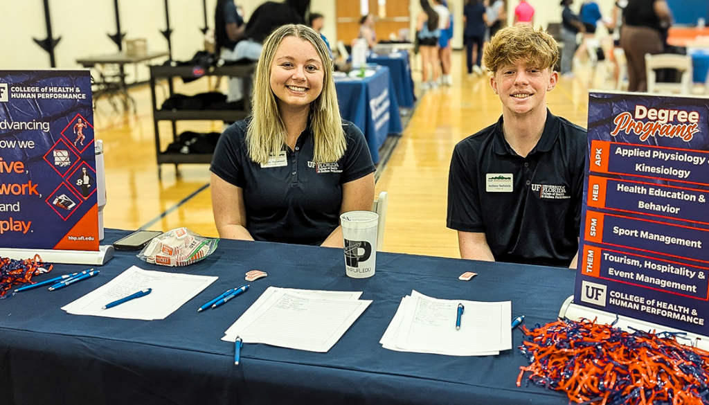 Two HHP student ambassadors manning a table at an event